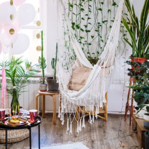 white hammock hanged on green plant